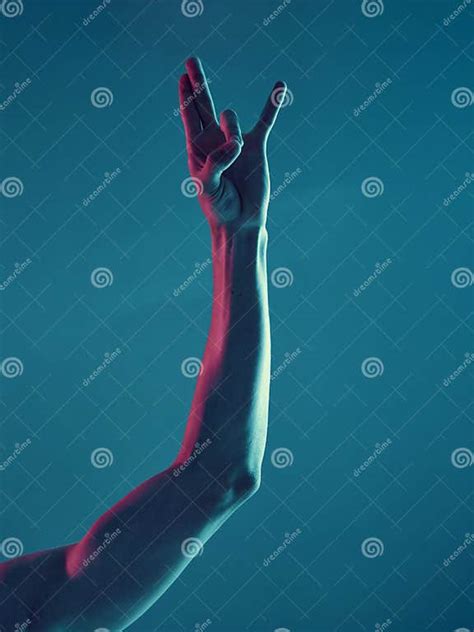 Male Hand in Shocker Gesture on Neon Blue Light Background. Concept ...