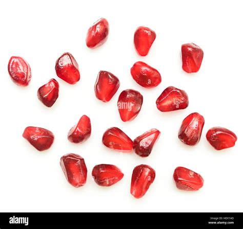 pomegranate seeds isolated on white background Stock Photo - Alamy