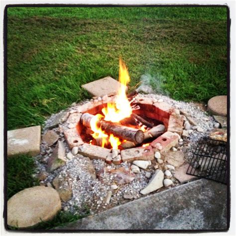 I made my own fire pit. Just dig a hole, fill with gravel, place bricks ...