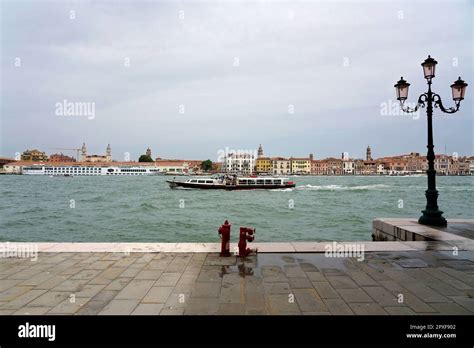 Giudecca canal viewed from Fondamenta di San Biagio and Venice skyline, Giudecca island, Venice ...