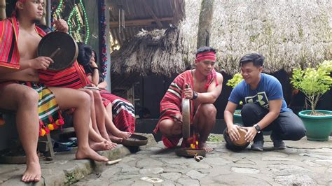 Igorot, teaching solibao to a kid - YouTube