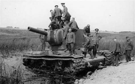 German soldiers examining knocked out heavy tank KV2 | World War Photos