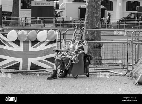 THE MALL, LONDON - 4 May 2023: Royalist outside of Buckingham Palace ahead of the Coronation of ...