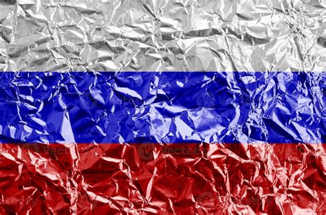 Russia flag depicted in paint colors on shiny crumpled aluminium foil ...