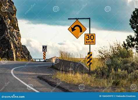 Yellow Warning Road Signs On Roadside Stock Photo | CartoonDealer.com #166545972