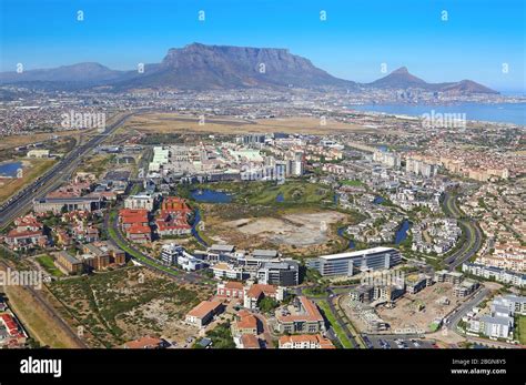 Aerial photo of Century City and N1 highway with Table Mountain and Cape Town CBD in the ...