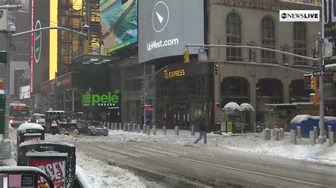 New York clears snow from Times Square as winter storm hits Northeast ...