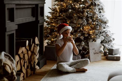 Premium Photo | Full length of woman sitting in christmas tree