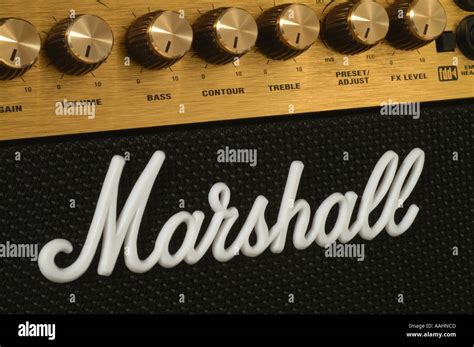 Marshall amplifier logo white plastic script on black cloth gold Stock ...