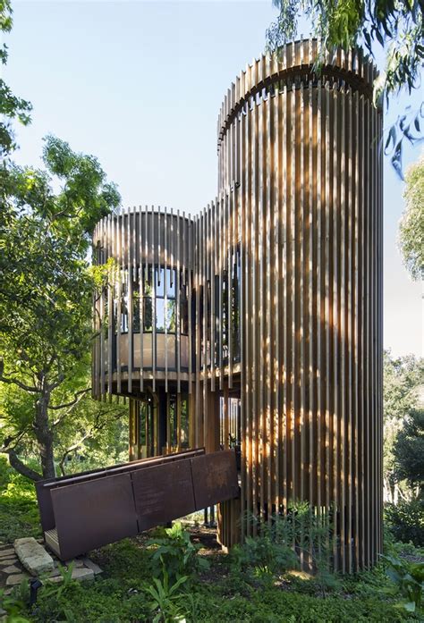 This contemporary treehouse-inspired cabin is a playful composition ...