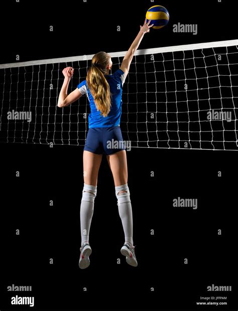 Young girl volleyball player isolated Stock Photo - Alamy