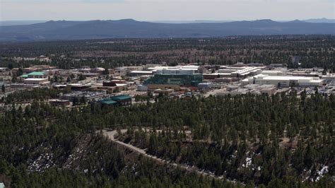 5.7K stock footage aerial video wide view of the Los Alamos National Laboratory during descent ...