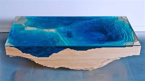This Abyss Table Is Designed To Look Like The Sea Floor With a Topographical Design