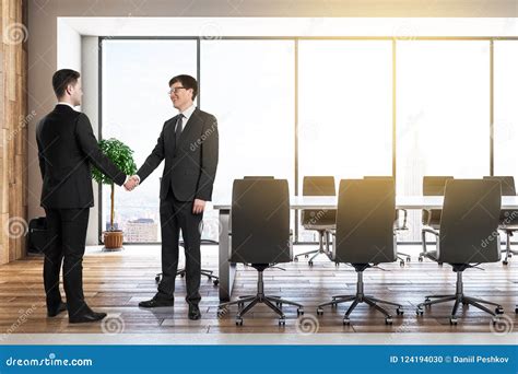 Businessmen Shaking Hands in Office Stock Photo - Image of loft ...