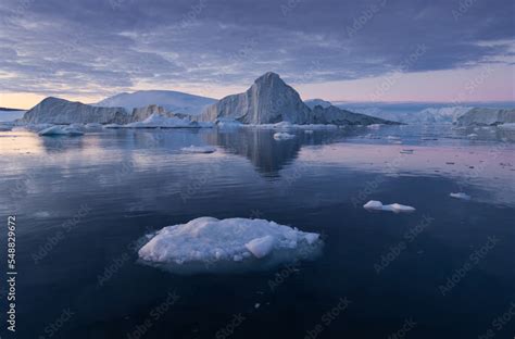 Iceberg at sunset. Nature and landscapes of Greenland. Disko bay. West ...