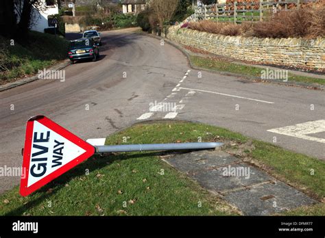 damaged Give Way road sign after an accident Stock Photo: 61308219 - Alamy