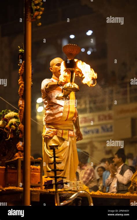 Ganga aarti, Portrait of an young priest performing river ganges ...