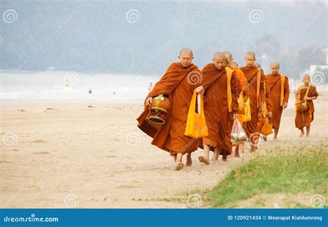 Thai monks asking for alms editorial stock image. Image of walk - 120921434