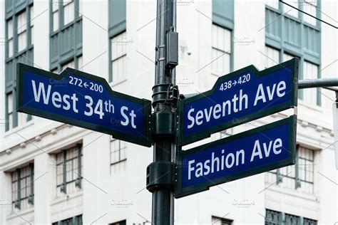 Road signs in midtown of new york featuring 34th, america, and american ...