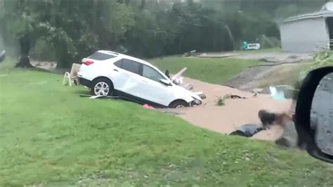 Ten dead and dozens missing after record rain and flash floods in ...