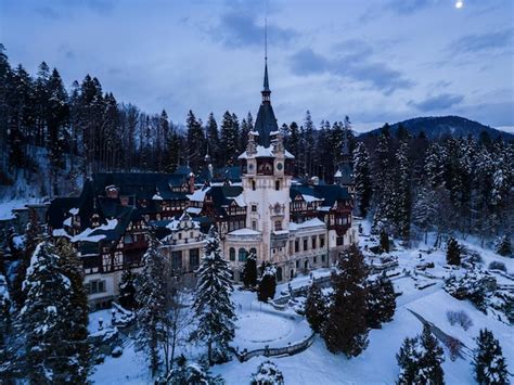 Premium Photo | Aerial view of peles castle in winter sinaia romania