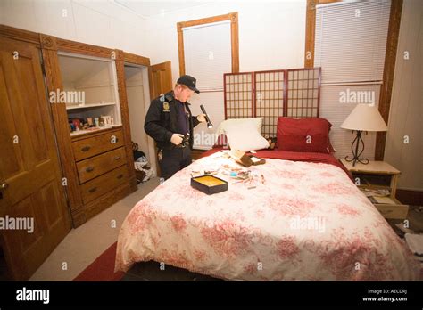 Crime Scene Technician looking through bedroom for trace evidence after ...