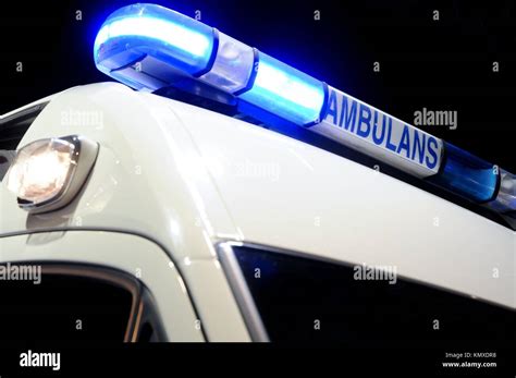 blue ambulance emergency light, isolated on black Stock Photo - Alamy