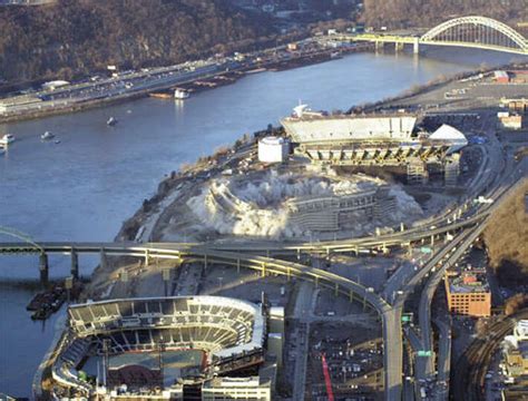 A cloud of dust rises from the implosion of Three Rivers Stadium ...