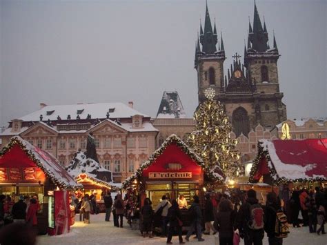 Christmas market at Old Town Square in Prague covered with snow ...