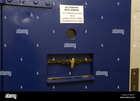 Police cell door showing instructions for inmates UK Stock Photo - Alamy