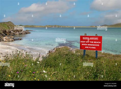 Red Warning Sign on Barra Airport on Traigh Mhor Beach at High Tide ...