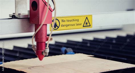 Laser CNC cutting wood. Modern machine industrial technology Stock ...