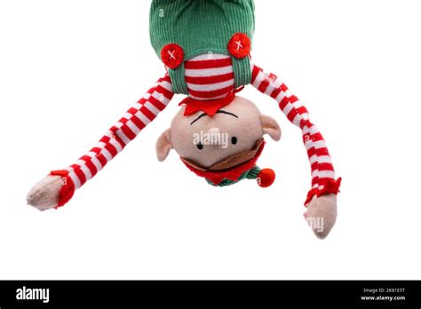 Elf on a Shelf hanging upside down isolated on white background Stock Photo - Alamy