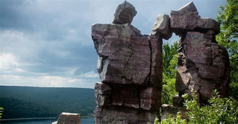 Gray Rock Formation Near Green Trees Under White Clouds · Free Stock Photo