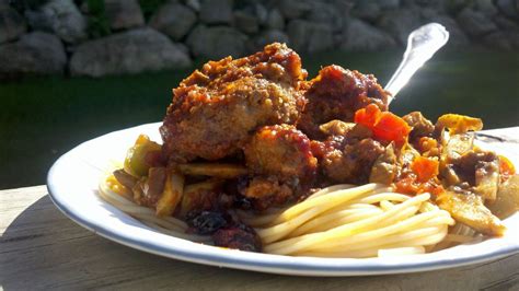 Meatballs simmered in blueberry-rich spaghetti sauce with mushrooms and grape tomatoes - mlive.com