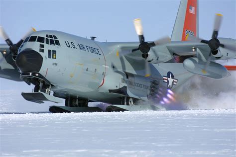 C-130 taking off from Antarctica with the assistance of a JATO package ...