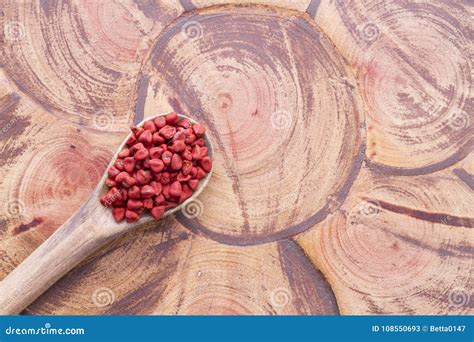 Achiote seeds on wood stock image. Image of annato, dish - 108550693