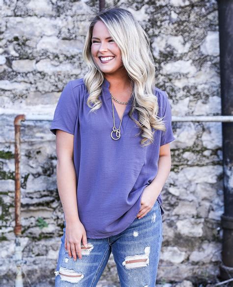 Our favorite top comes in this fun purple color! Throw a little color ...