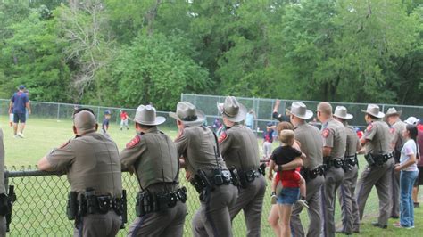 Texas officers attend baseball game of injured trooper's son