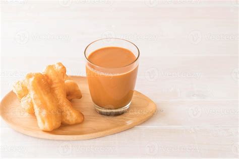 Deep-fried dough stick with milk tea on wood 3109020 Stock Photo at ...