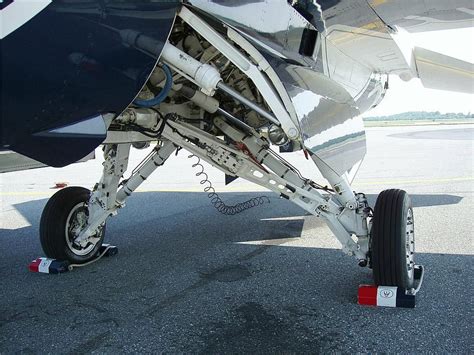 an airplane's rear wheel is attached to the engine and landing gear on ...