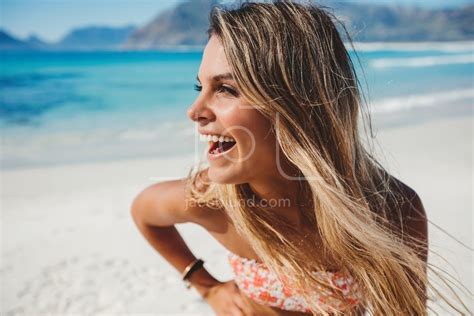 Attractive young woman laughing on the beach – Jacob Lund Photography ...