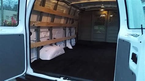 Cargo Van Interior with Storage Bins and Shelves