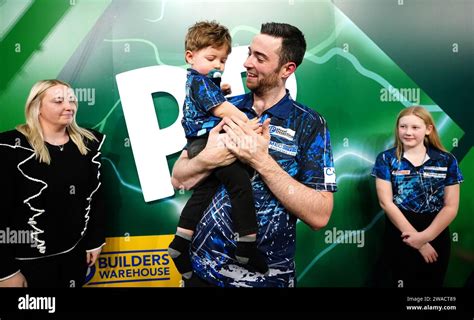 Luke Humphries celebrates with his family after winning the final of the Paddy Power World Darts ...