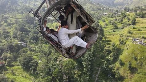 Pakistan: Drone shows children trapped in cable car dangling over river canyon | World News ...