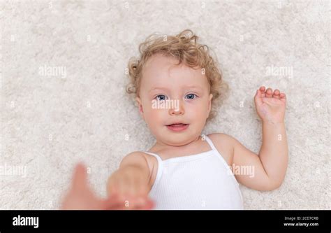 Little girl lying on blanket hi-res stock photography and images - Alamy