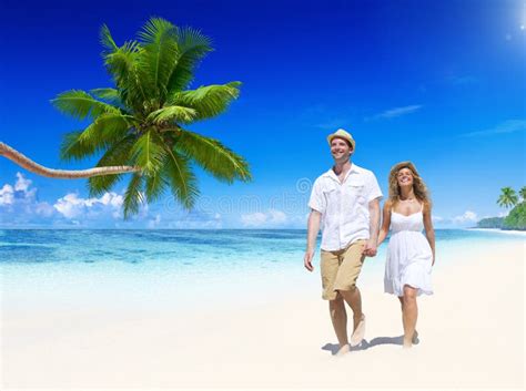 Couple Relaxing On The Beach Stock Image - Image of caucasian, paradise ...