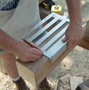 a man is working on something with wood