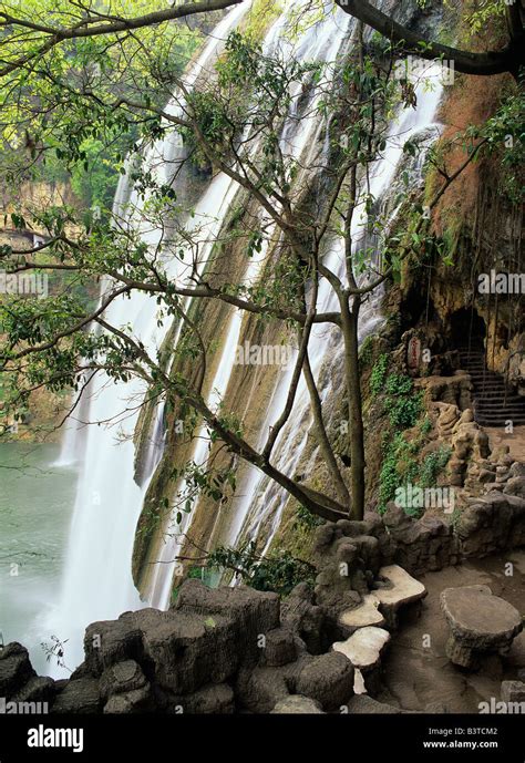 Asia, China, Guizhou, Anshun. Cave behind Huangguoshu Falls, largest ...