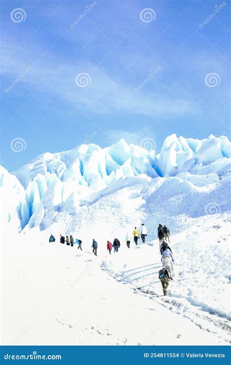 Group of People Hiking on the Perito Moreno Glacier, in Patagonia. Copy ...